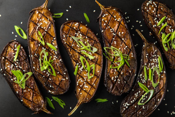 istock glazed grilled eggplants served with sesame seeds and green onion 893569112