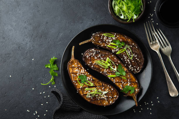 istock glazed grilled eggplants served with sesame seeds and green onion 893569124