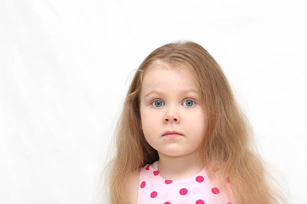 istock Child with blue eyes closely looks 89357352