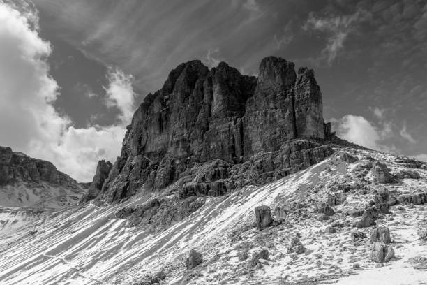 istock monochrome Dolomite mountain peak after a fresh snowfall in the fall 893576388