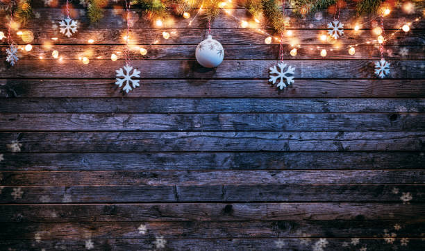 istock Christmas background with wooden decorations and spot lights. 893576776