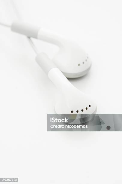 White Earphones Stock Photo - Download Image Now - Audio Equipment, Cable, Color Image