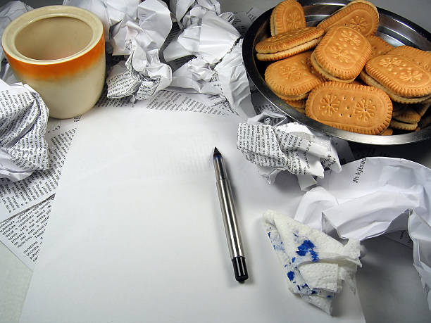 Writing inspiration - torn pages, cookies, snacks stock photo