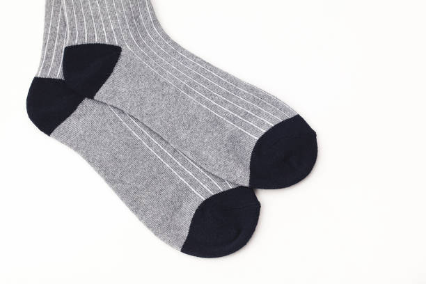 istock a pair of silver socks for winter on isolated white backgrounds 893581360