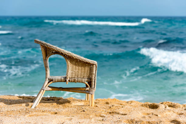 istock Straw chair on the beach 893581488