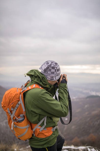 istock Photographer hiker in nature 893582118