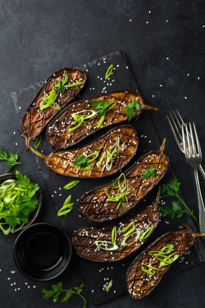 istock glazed grilled eggplants served with sesame seeds and green onion 893582246