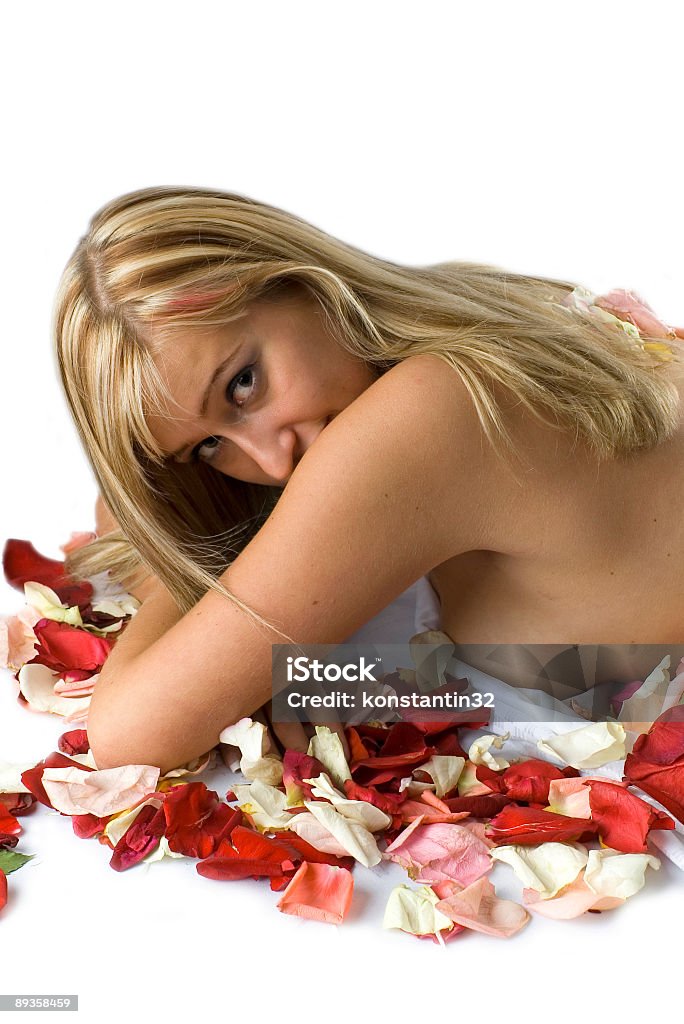 blonde with flower petals and madonna lily  Adult Stock Photo