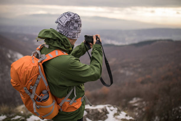 istock Photographer hiker in nature 893584604