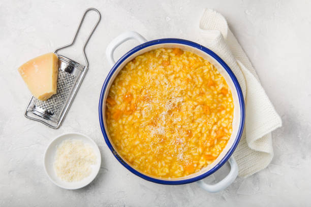 delicious pumpkin risotto with parmesan cheese stock photo