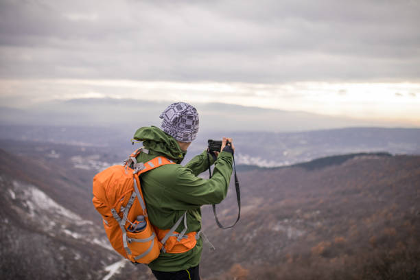 istock Photographer hiker in nature 893585050