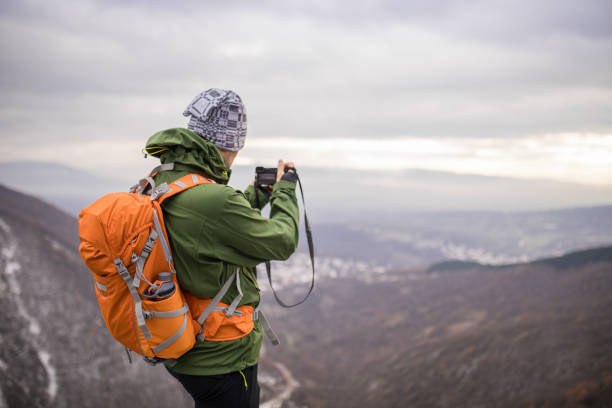 istock Photographer hiker in nature 893585538
