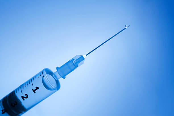 istock Syringe with drop of medicine 89358555