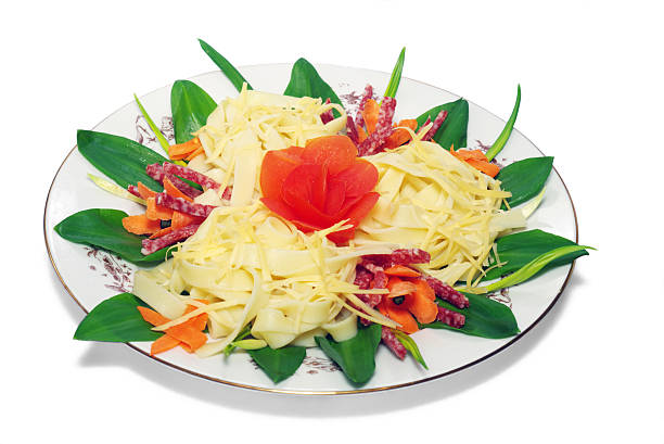 istock Pasta with cheese, salami, tomatoes on a white plate, isolated 89358936