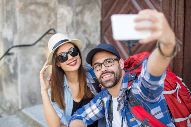istock Young couple taking a selfie 893590250