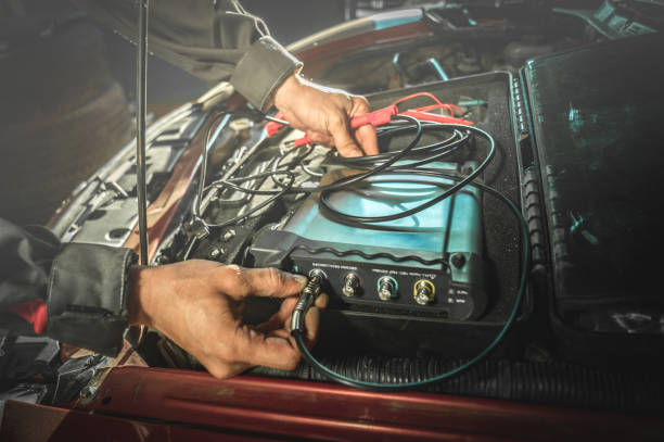istock hands of electrician connect the oscilloscope 893594580