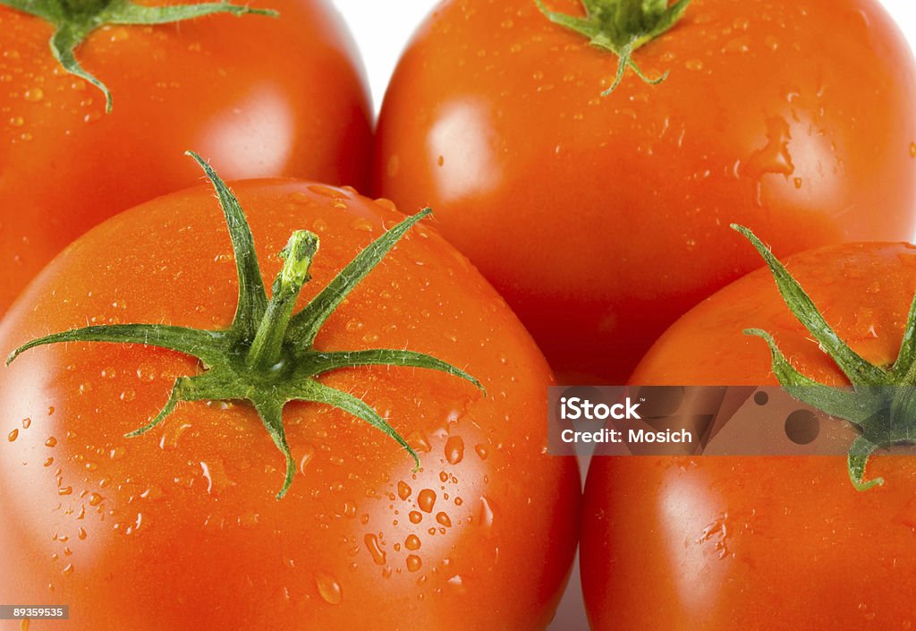 Cuatro tomates completo - Foto de stock de Agua libre de derechos