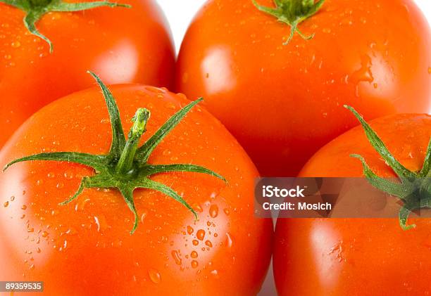 Cuatro Tomates Completo Foto de stock y más banco de imágenes de Agua - Agua, Alimento, Color - Tipo de imagen
