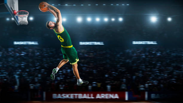 istock one basketball player jump in stadium panorama view 893599676