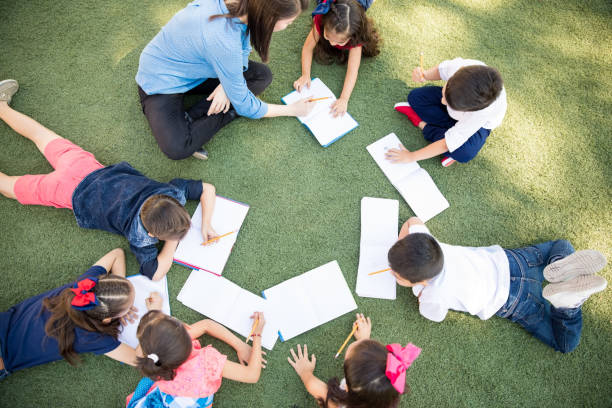 istock Preschoolers taking a class outdoors 893600726