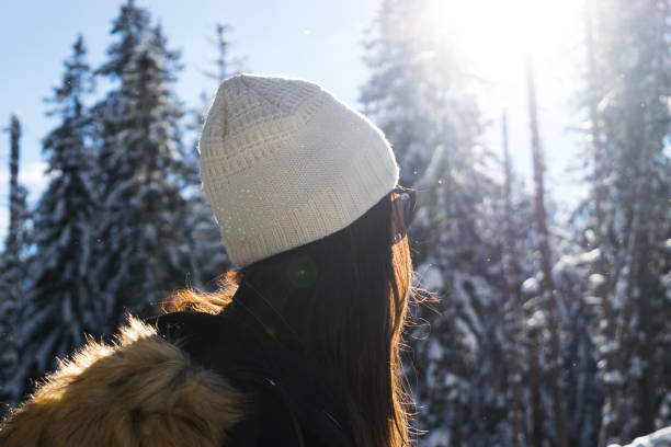 istock Young female portrait with a hat looking to background giving back 893603858