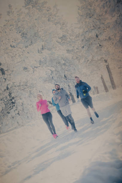 istock Four sportspeople running on mountain 893603940