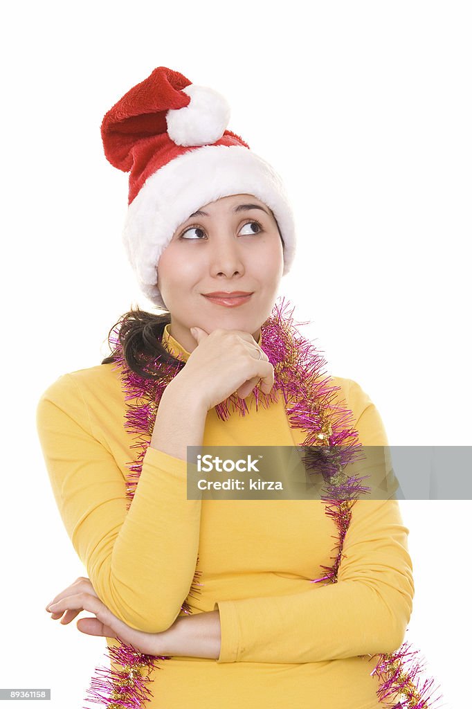 Pensive asiatique fille dans le chapeau de santa - Photo de Adulte libre de droits