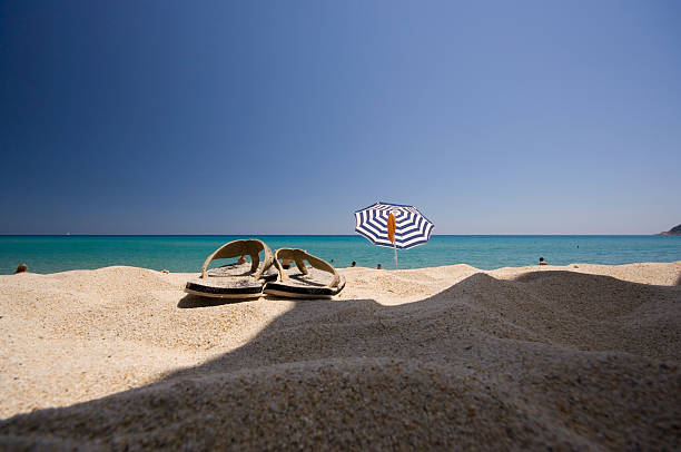 sandals and beach stock photo