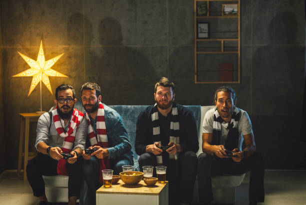 istock Men Socializing at Home - Playing Video Games 893616046