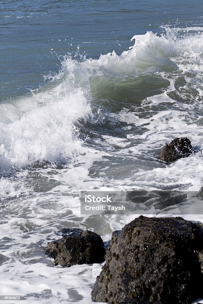 Wave Passing Between Two Rocks Wave And Rock Stock Photo - Download Image Now - Breaking Wave, Color ...
