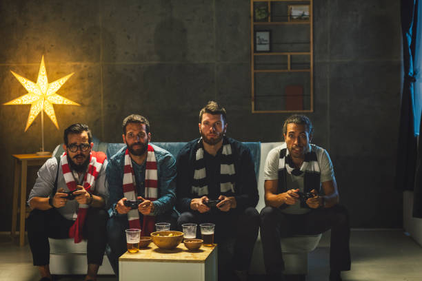 istock Men Socializing at Home - Playing Video Games 893616992
