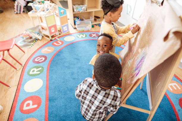 istock Kids in daycare having fun 893618782