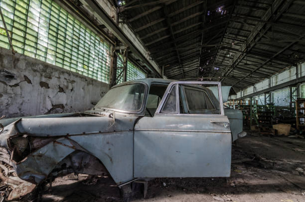istock old broken car in storehouse 893621228