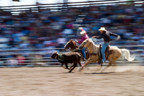 Gran Canaria - April 2023: Sioux City park showcases horse riding shows and photo opportunities with cowboy riders and Native American Indians in traditional attire.