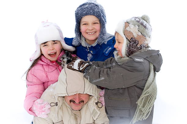 istock Kids Playing with Dad in the Snow 89363882
