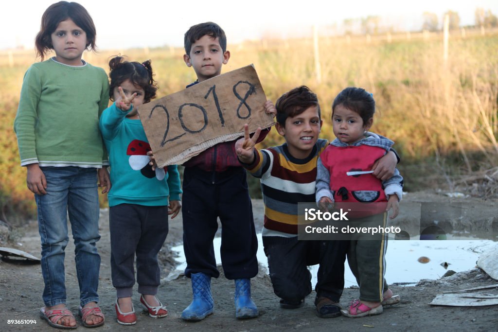 2018 refugee camp syria - kids showing paper camp refugee, 2018, playing kids, syria, syrian kids Child Stock Photo