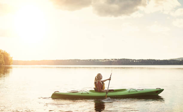 istock Paddling out onto perfectly still water 893651298