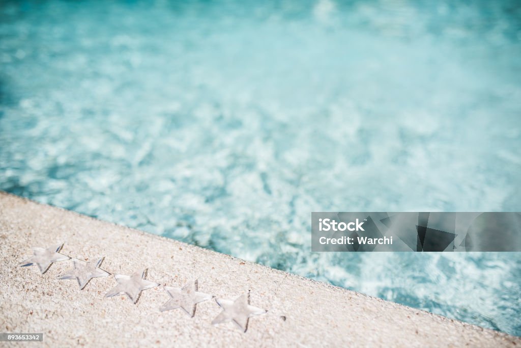 Five stars ressort Five transparent stars on a pool side Rating Stock Photo