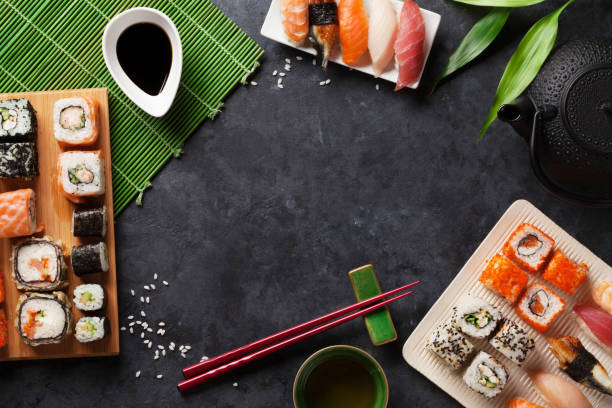 istock Set of sushi and maki roll and green tea 893673004