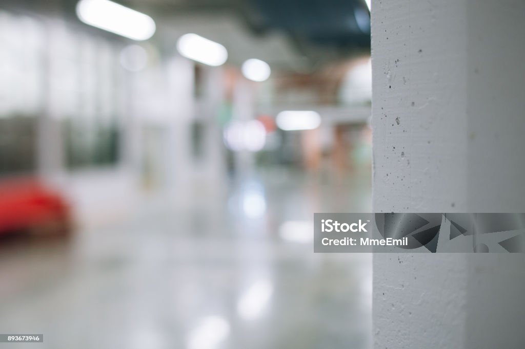 Details of a modern commercial and industrial building corridor renovated, revamped and refurbished. New business background. Startup. Empty open plan workspace. Defocused Stock Photo