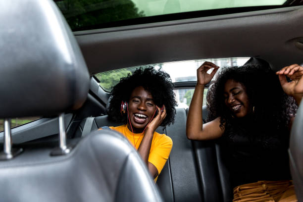 istock Afro girls having fun in the car 893675894