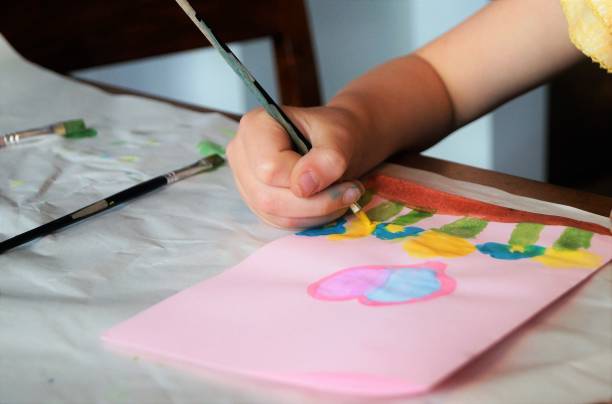 istock Child making Mother’s Day card. Traditional play concept. 893701782