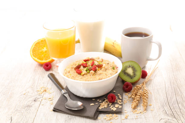 istock oat meal,coffee cup and orange juice 893707974
