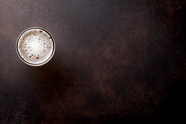 Lager beer mug Lager beer mug on stone table. Top view with copy space pub table top view stock pictures, royalty-free photos & images