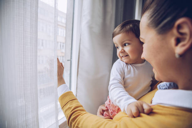 istock Family looking out the window 893757608