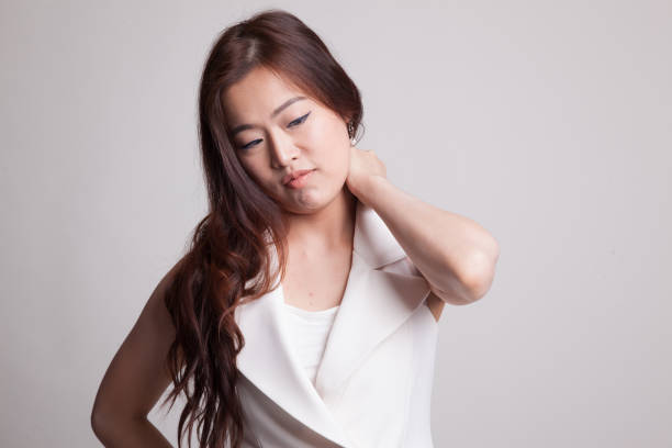 istock Young Asian woman got neck pain. 893761480