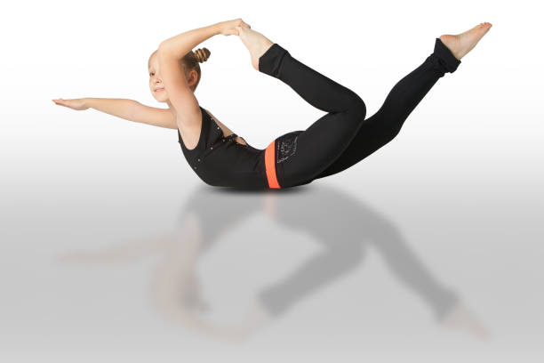 istock beautiful woman doing yoguna white background 893773820