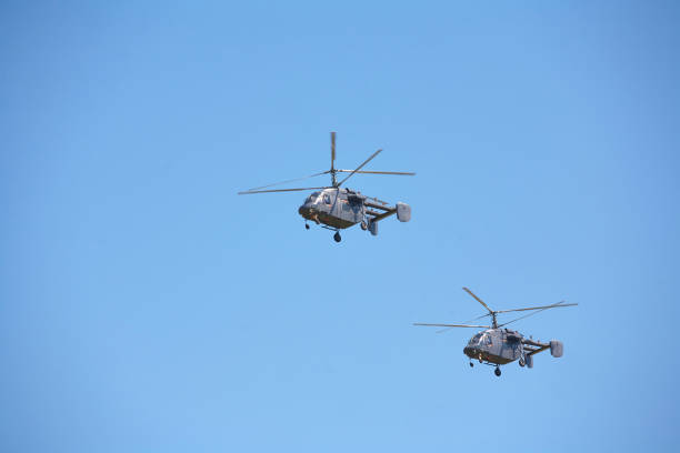 istock Two military helicopters against the blue sky. 893797464