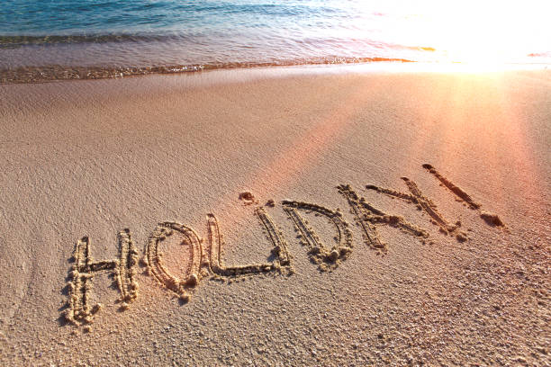 istock On a beach it is written holiday 893805470
