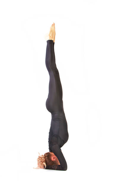 istock beautiful flexible woman doing yoga poses on white 893805530